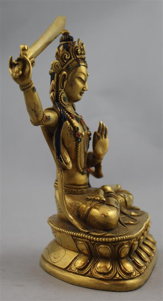 A Sino-Tibetan gilt bronze seated figure of Manjushri, 19cm